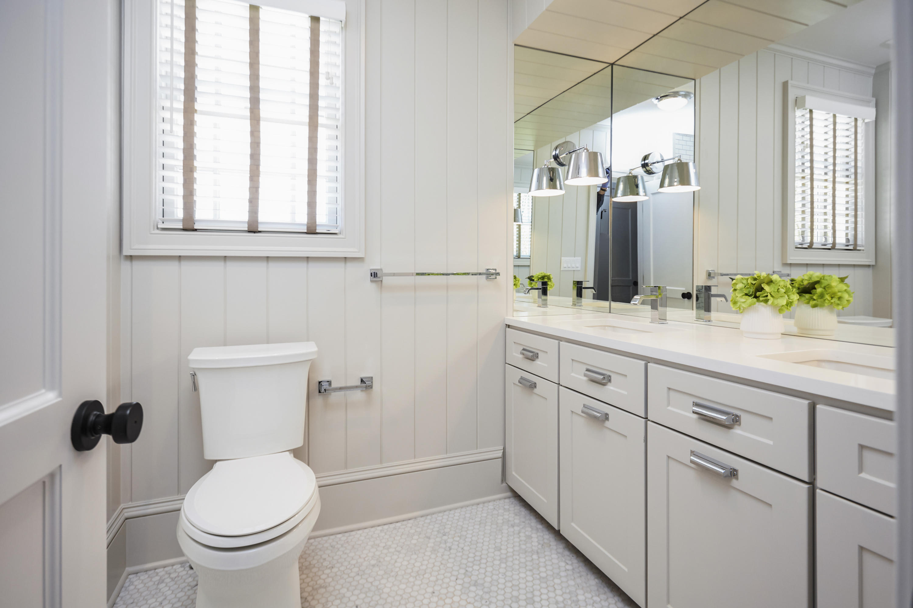 756 Ponus Ridge Road New Canaan, CT 06840 - Photo 27 of 54 a bathroom with a toilet sink and mirror