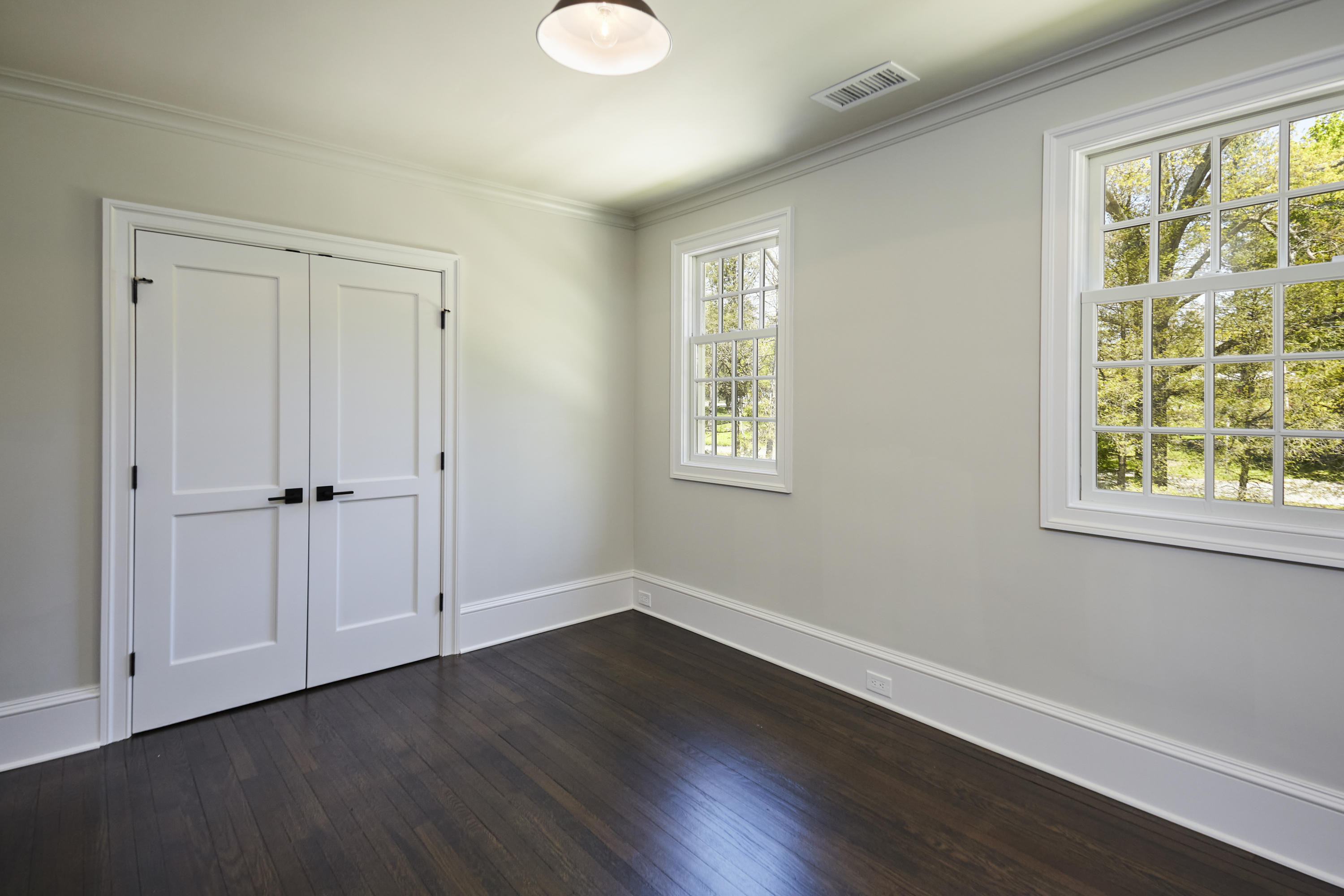 756 Ponus Ridge Road New Canaan, CT 06840 - Photo 28 of 54 a view of an empty room with wooden floor and a window