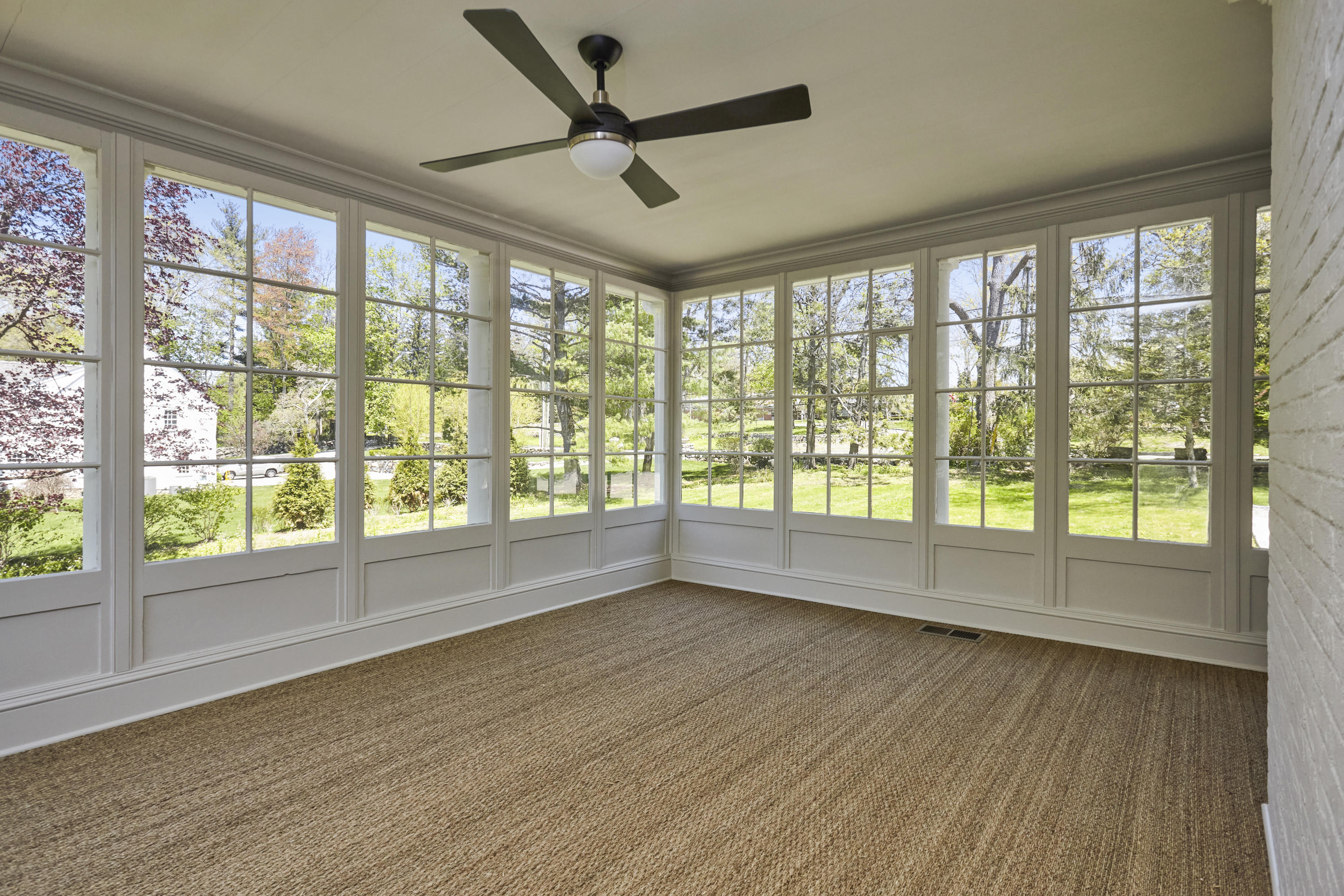 756 Ponus Ridge Road New Canaan, CT 06840 - Photo 3 of 54 a view of empty room with wooden floor and fan
