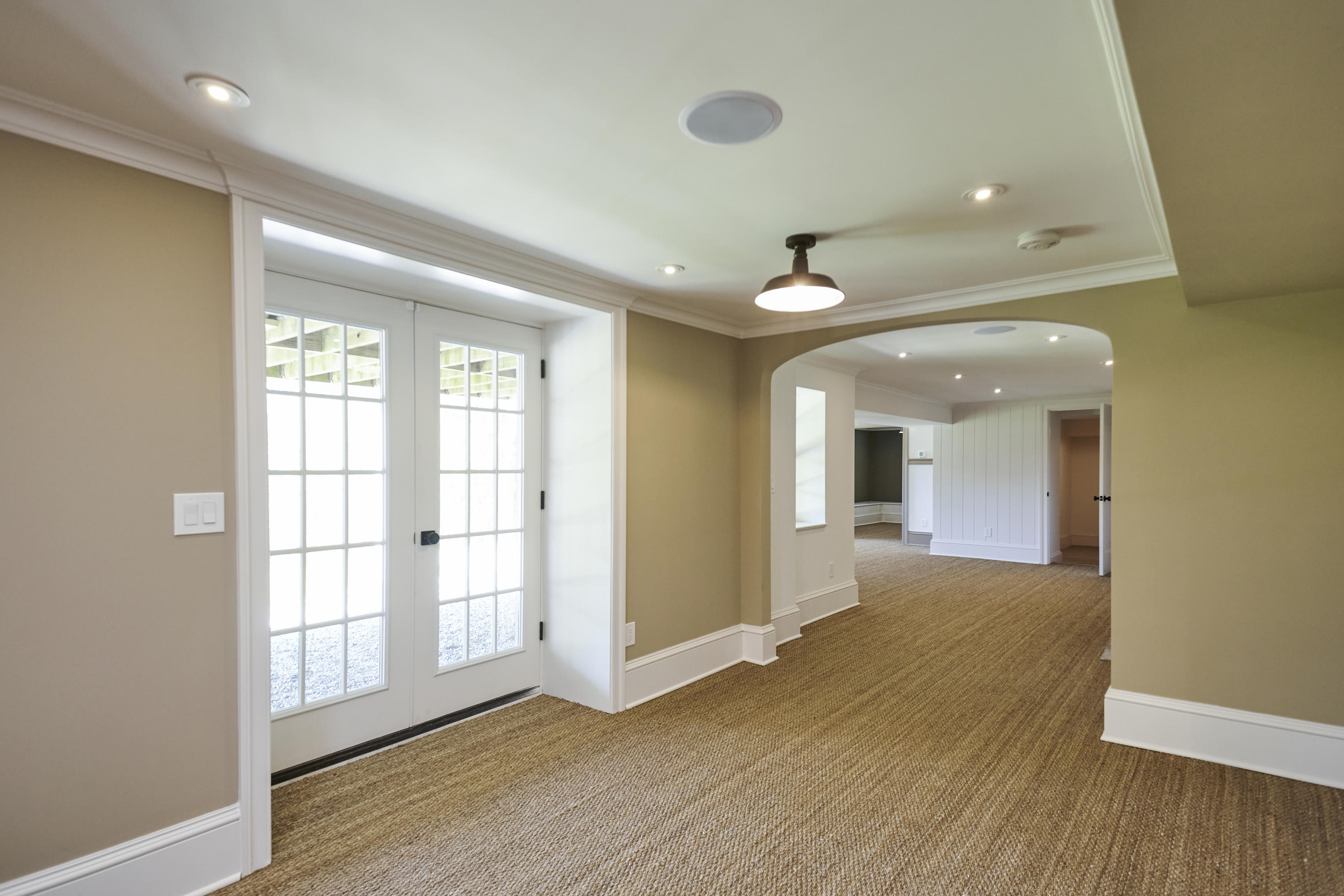 756 Ponus Ridge Road New Canaan, CT 06840 - Photo 33 of 54 an empty room with wooden floor and windows