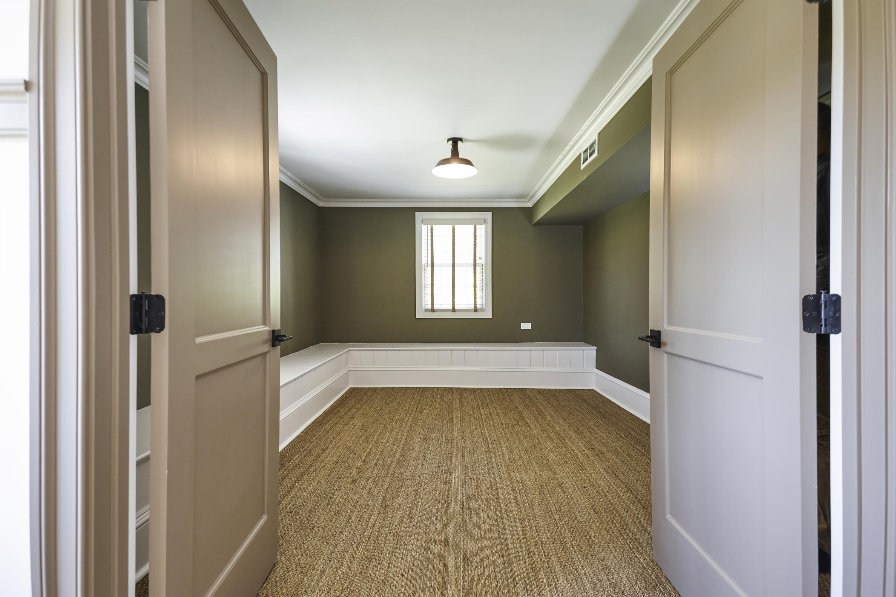 756 Ponus Ridge Road New Canaan, CT 06840 - Photo 35 of 54 a view of a hallway with wooden floor and staircase