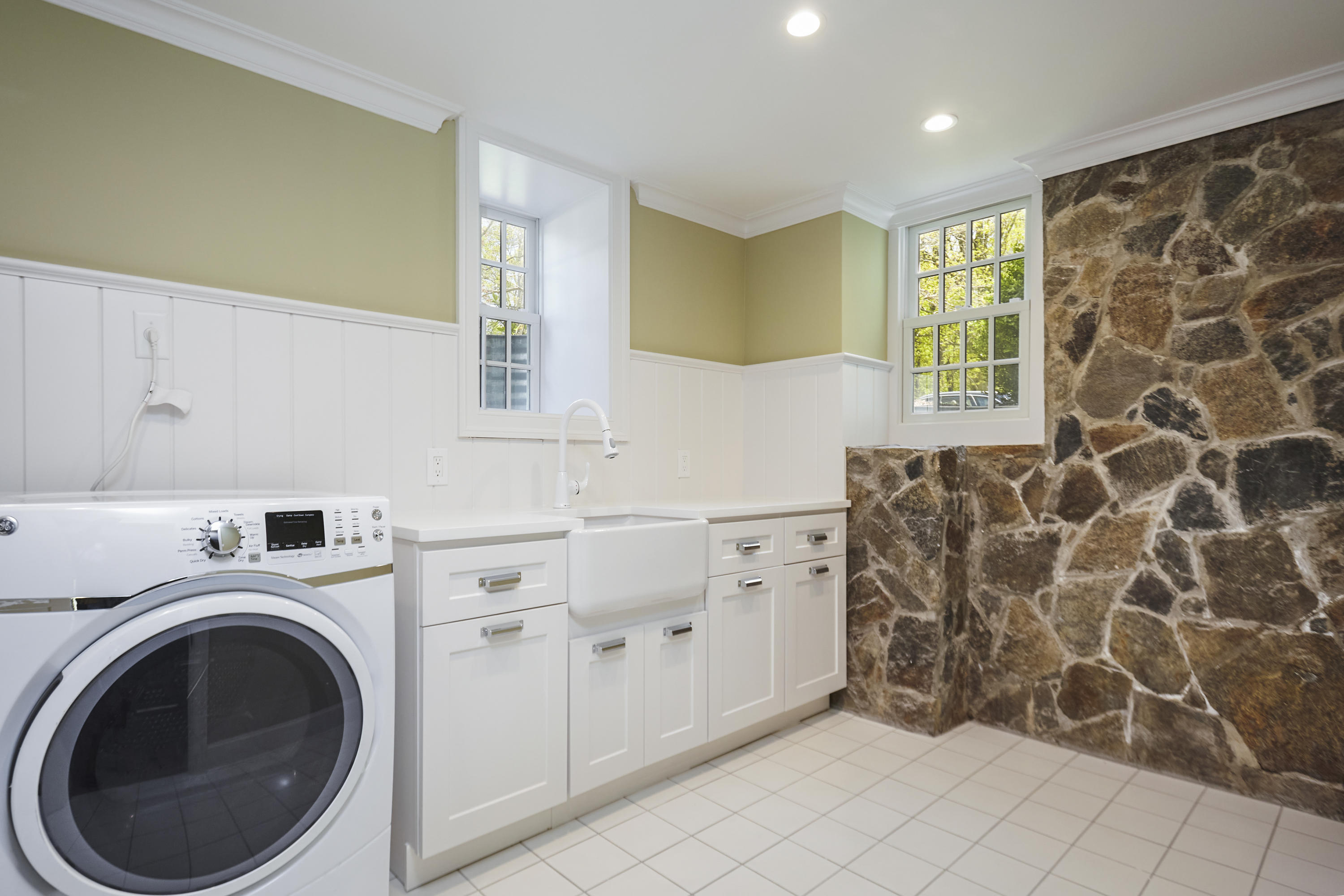 756 Ponus Ridge Road New Canaan, CT 06840 - Photo 37 of 54 a utility room with cabinets washer and dryer