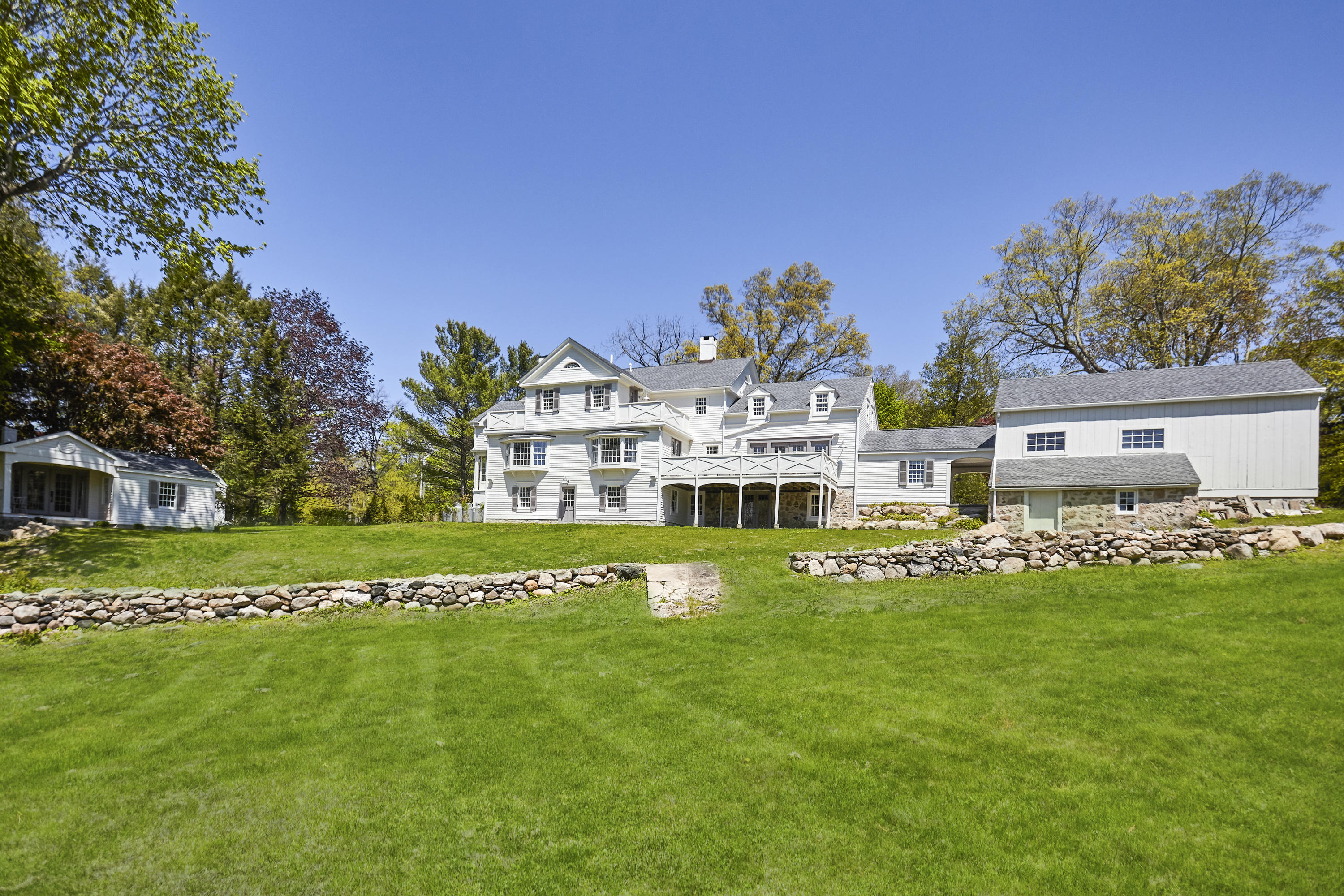756 Ponus Ridge Road New Canaan, CT 06840 - Photo 39 of 54 a view of a house with a big yard