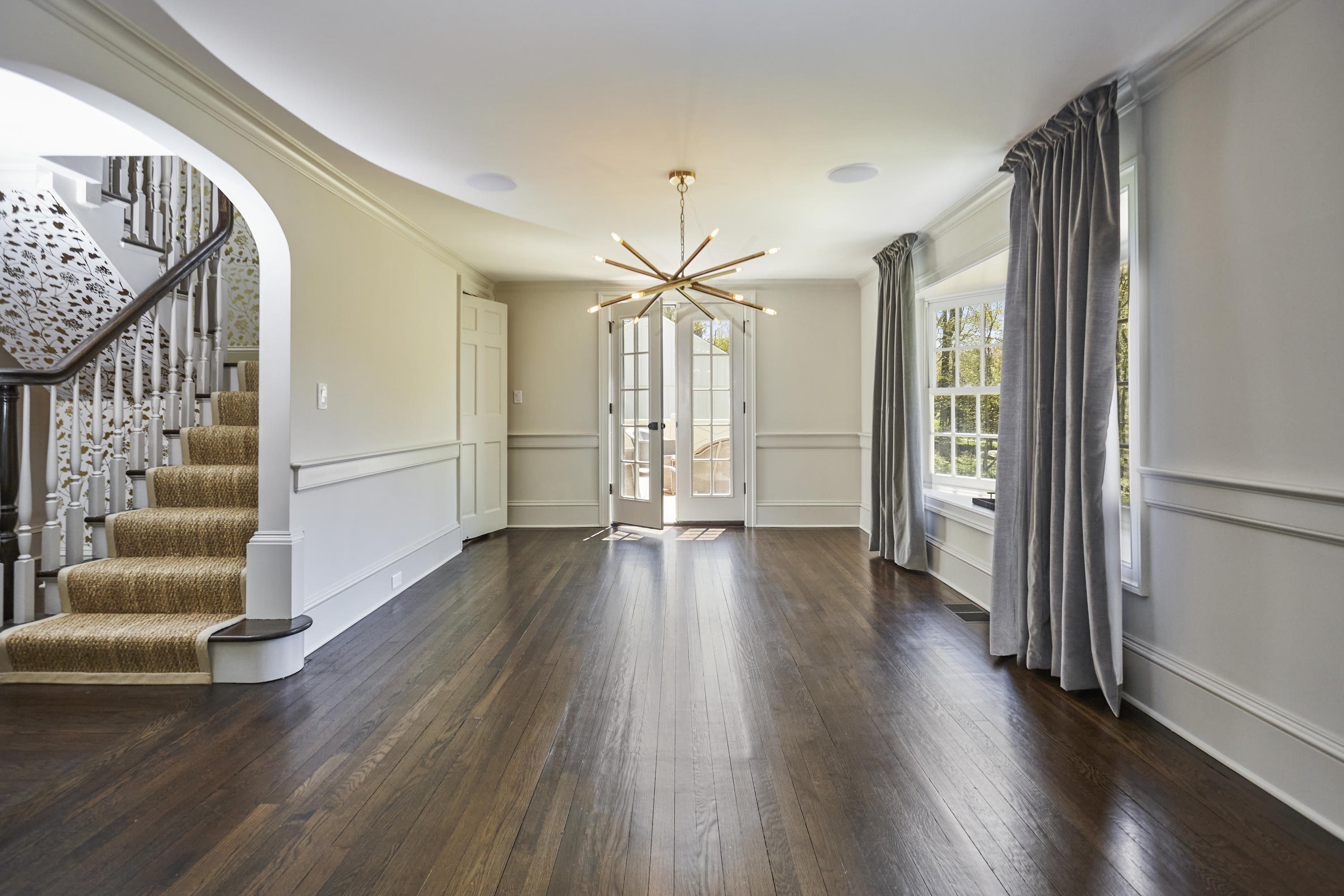 756 Ponus Ridge Road New Canaan, CT 06840 - Photo 4 of 54 a view of an entryway with wooden floor and stairs