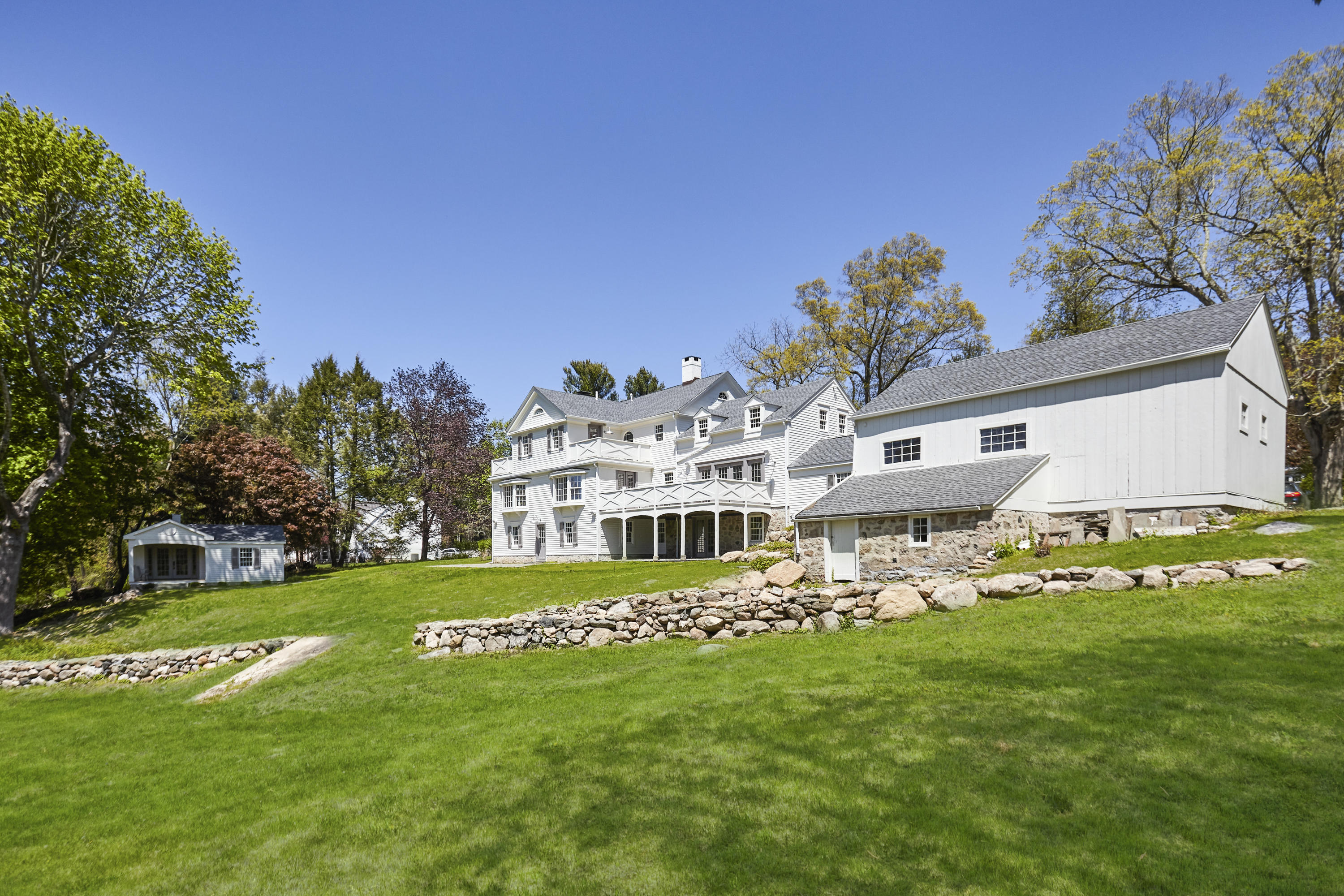 756 Ponus Ridge Road New Canaan, CT 06840 - Photo 41 of 54 a view of a house with a big yard