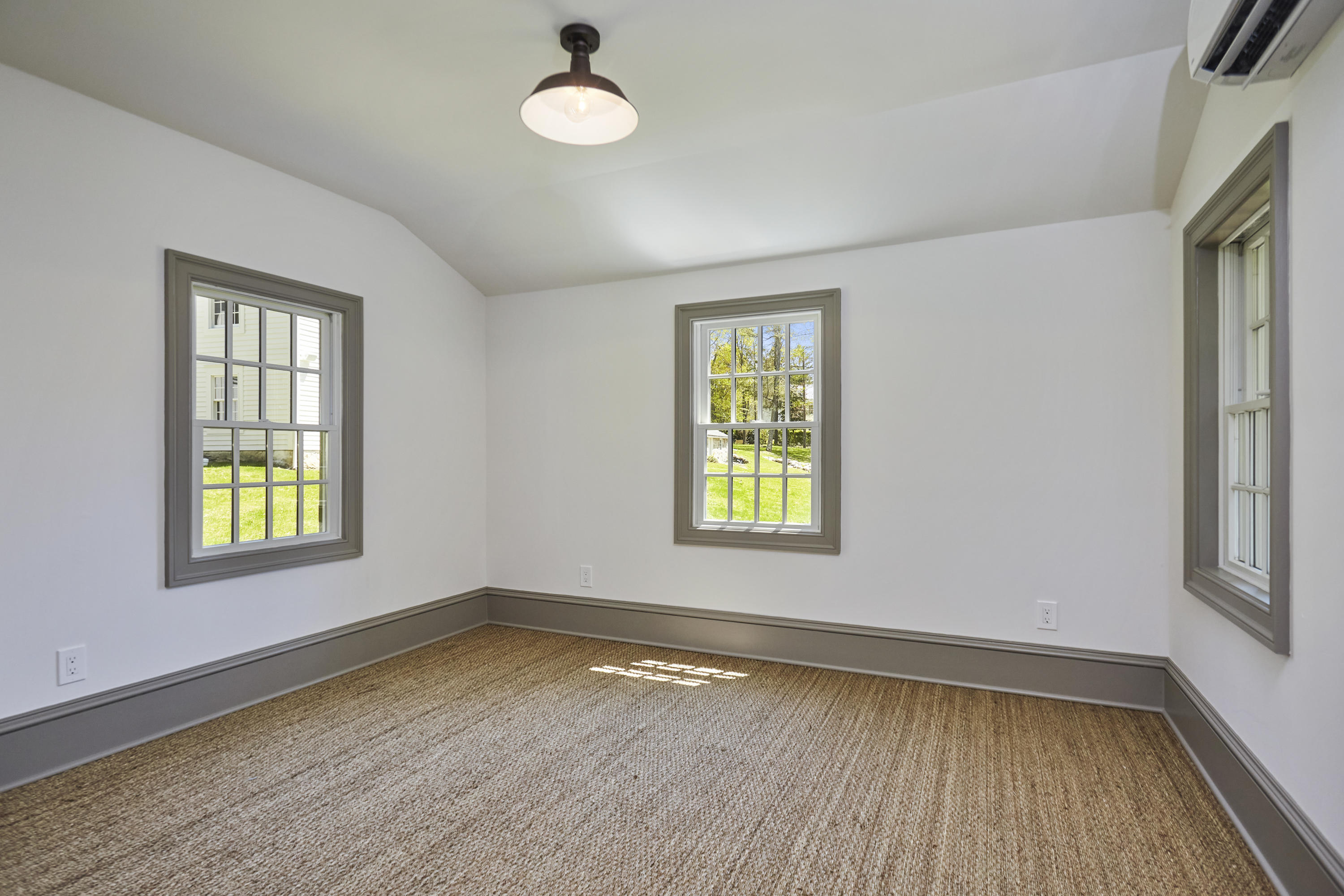 756 Ponus Ridge Road New Canaan, CT 06840 - Photo 44 of 54 wooden floor in an empty room with a window and wooden floor