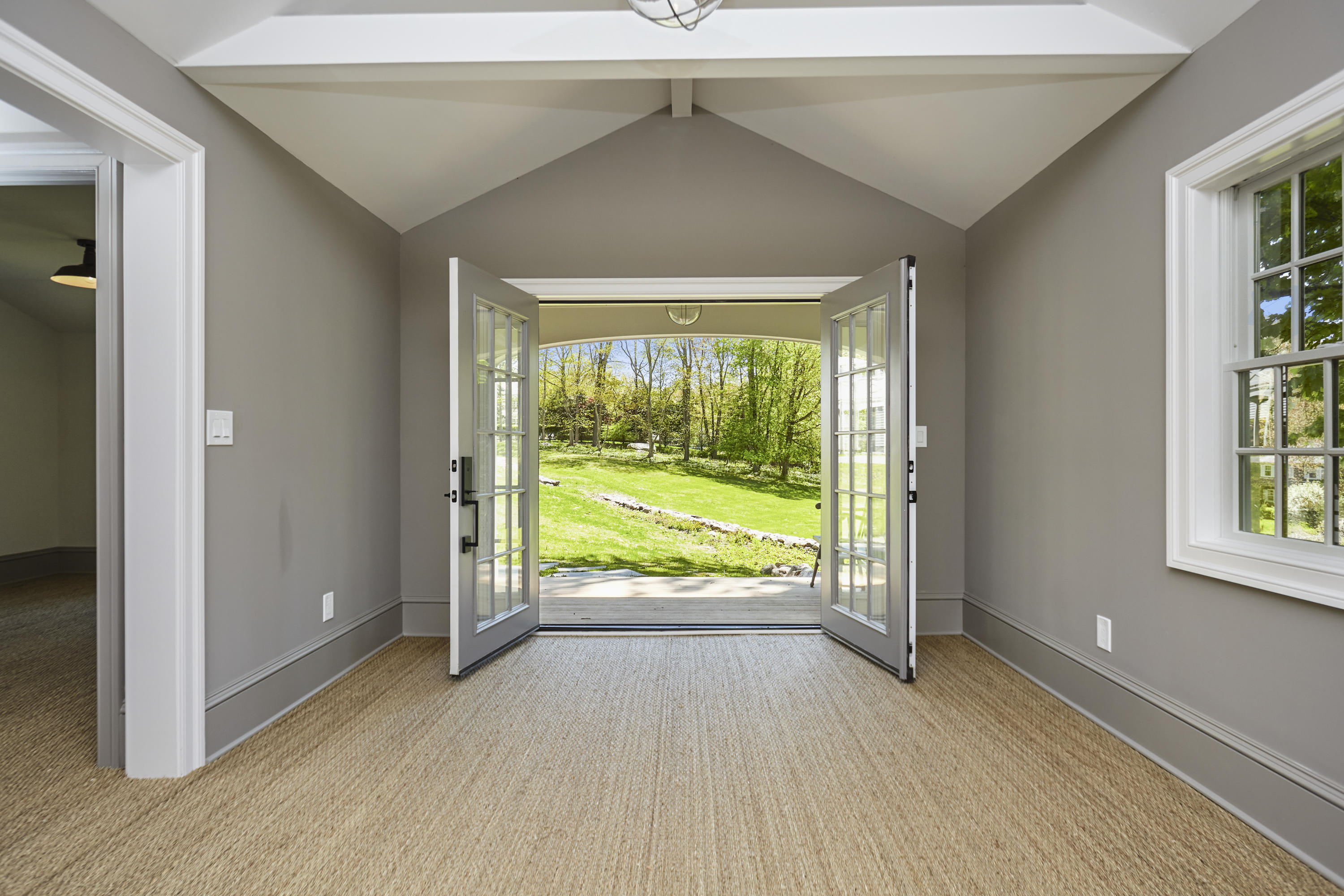 756 Ponus Ridge Road New Canaan, CT 06840 - Photo 45 of 54 an empty room with windows lake and mountain view