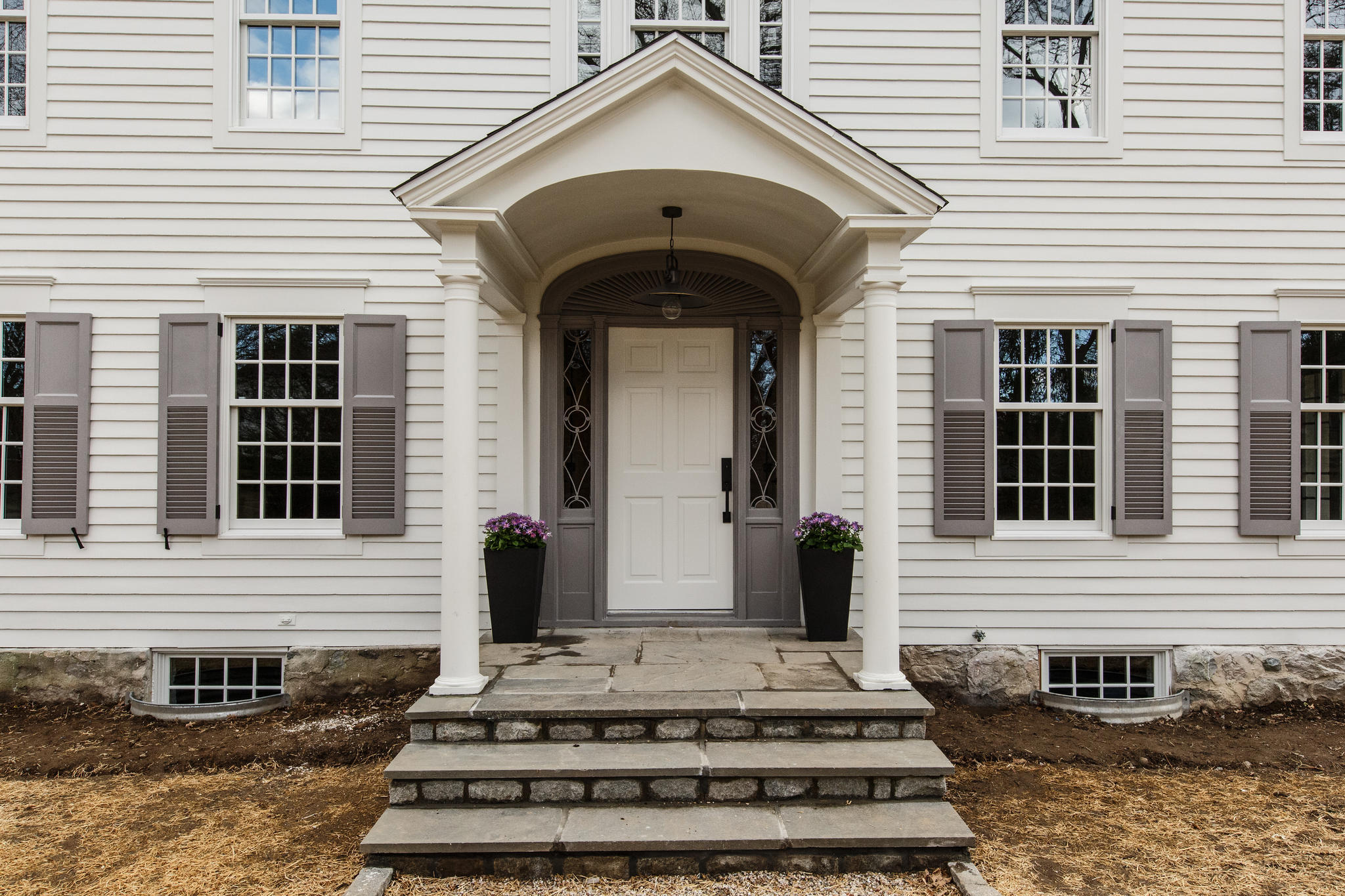 756 Ponus Ridge Road New Canaan, CT 06840 - Photo 47 of 54 a front view of a house with a rug