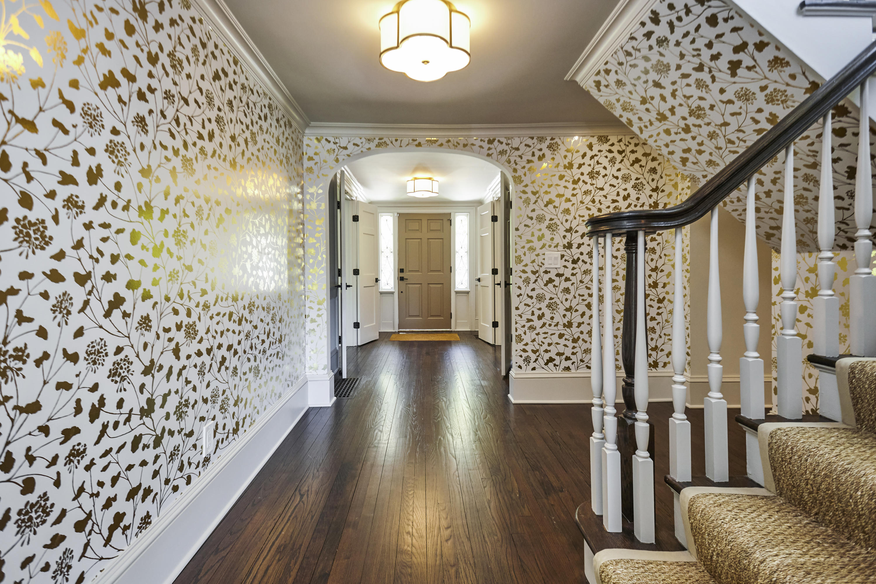 756 Ponus Ridge Road New Canaan, CT 06840 - Photo 48 of 54 a view of a hallway with wooden floor and staircase