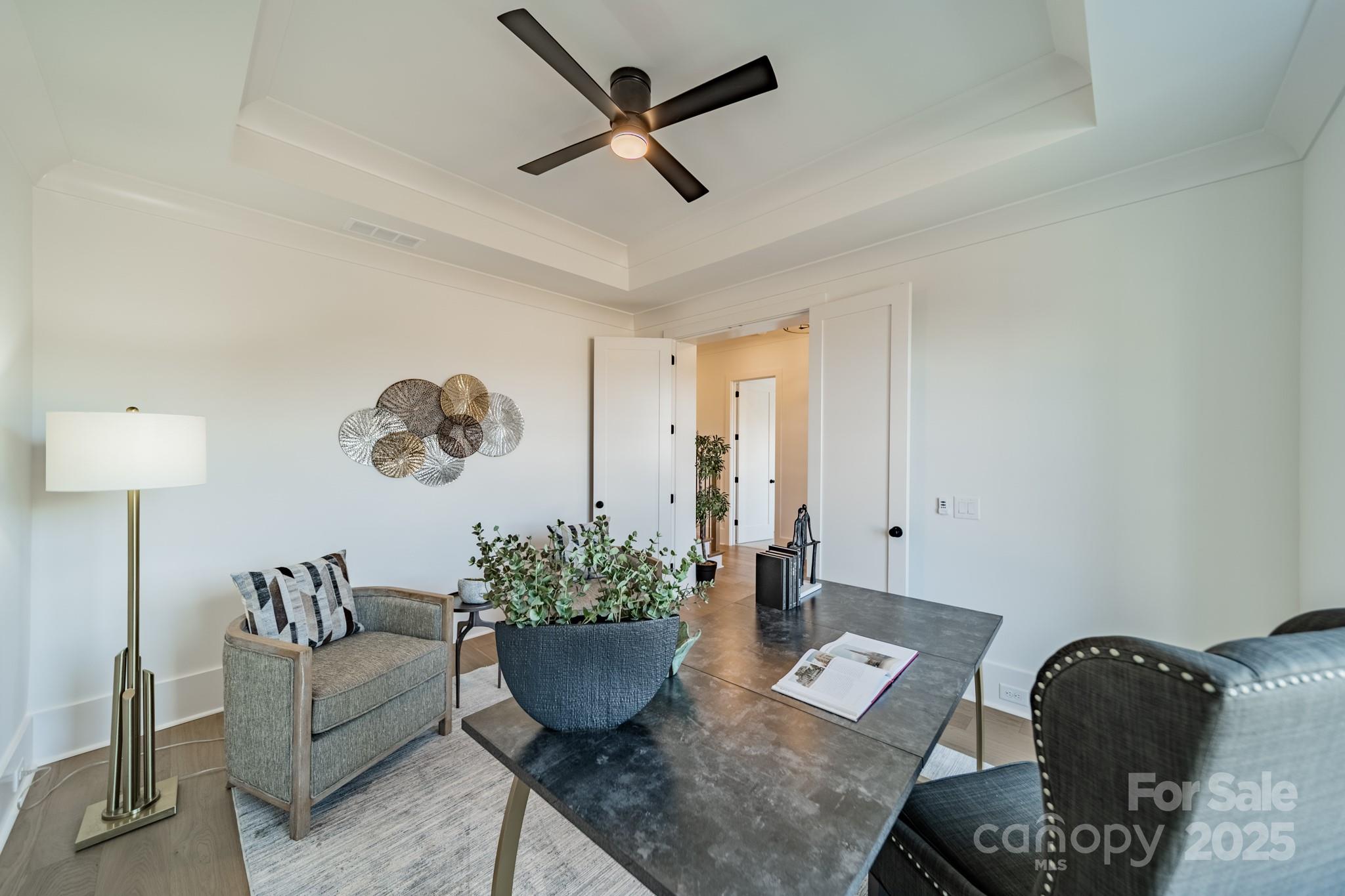 19032 Newburg Hill Road, Unit 23 Davidson, NC 28036 - Photo 24 of 39 a living room with furniture potted plant and a window