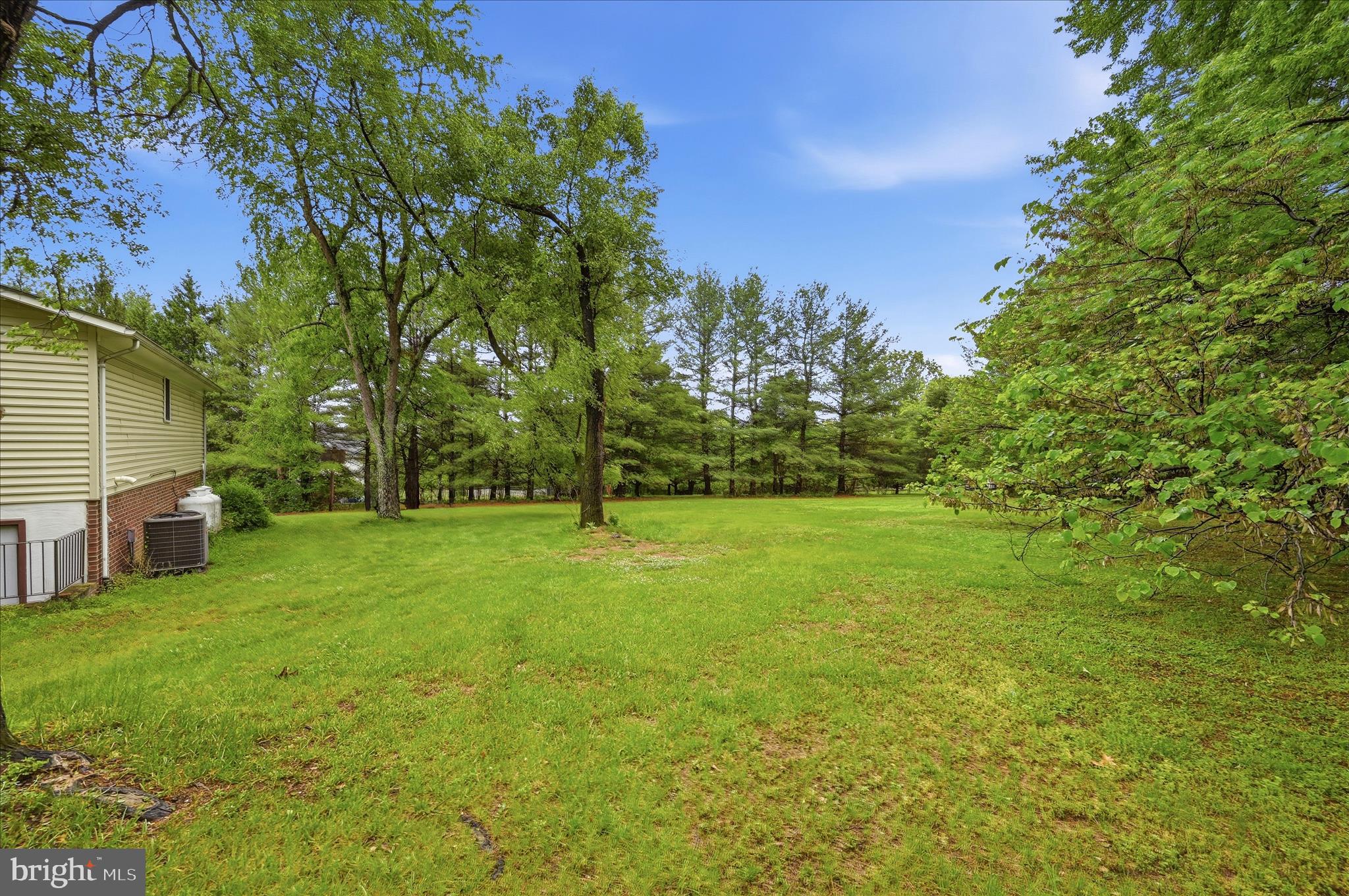 244 High Banks Road Stephenson, VA 22656 - Photo 35 of 45 a view of a yard with a house in the background