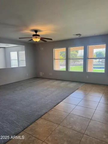 an empty room with a empty space and windows