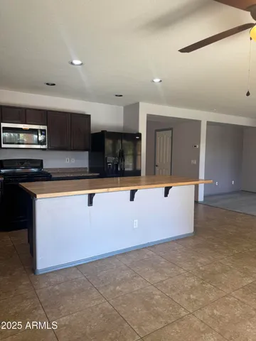 a view of kitchen with cabinets and wooden floor