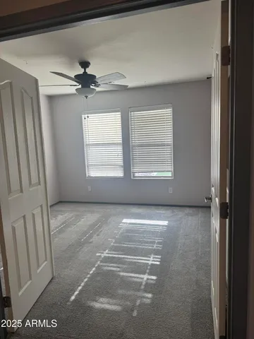 a view of an empty room and a window