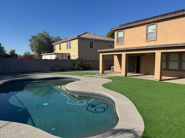 a view of a house with a swimming pool