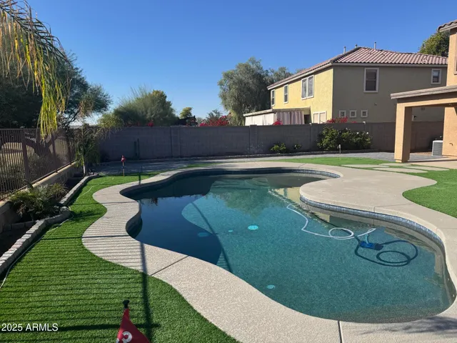 a view of a house with swimming pool