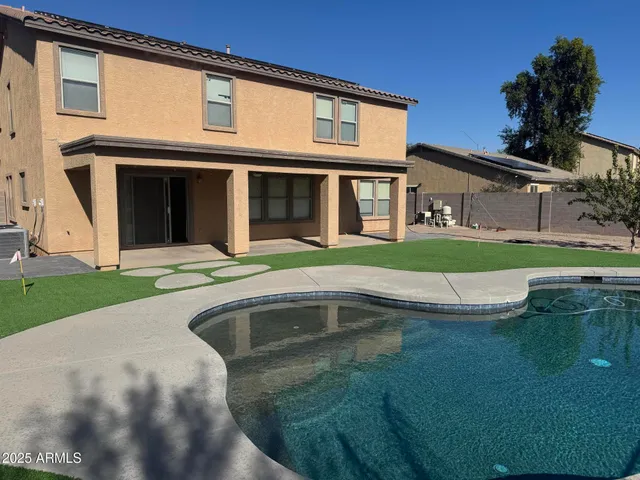 a view of a house with a swimming pool