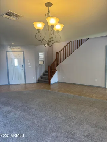 a view of a room with a mirror and fan