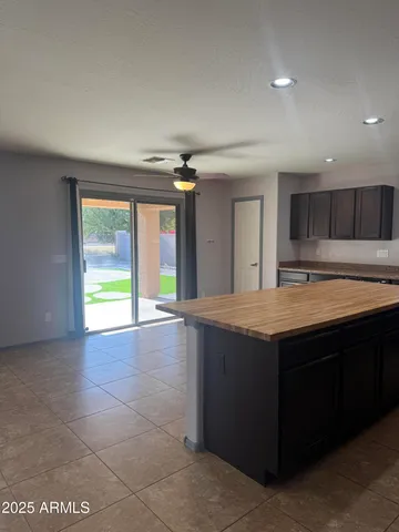 a kitchen with stainless steel appliances granite countertop a stove and a sink