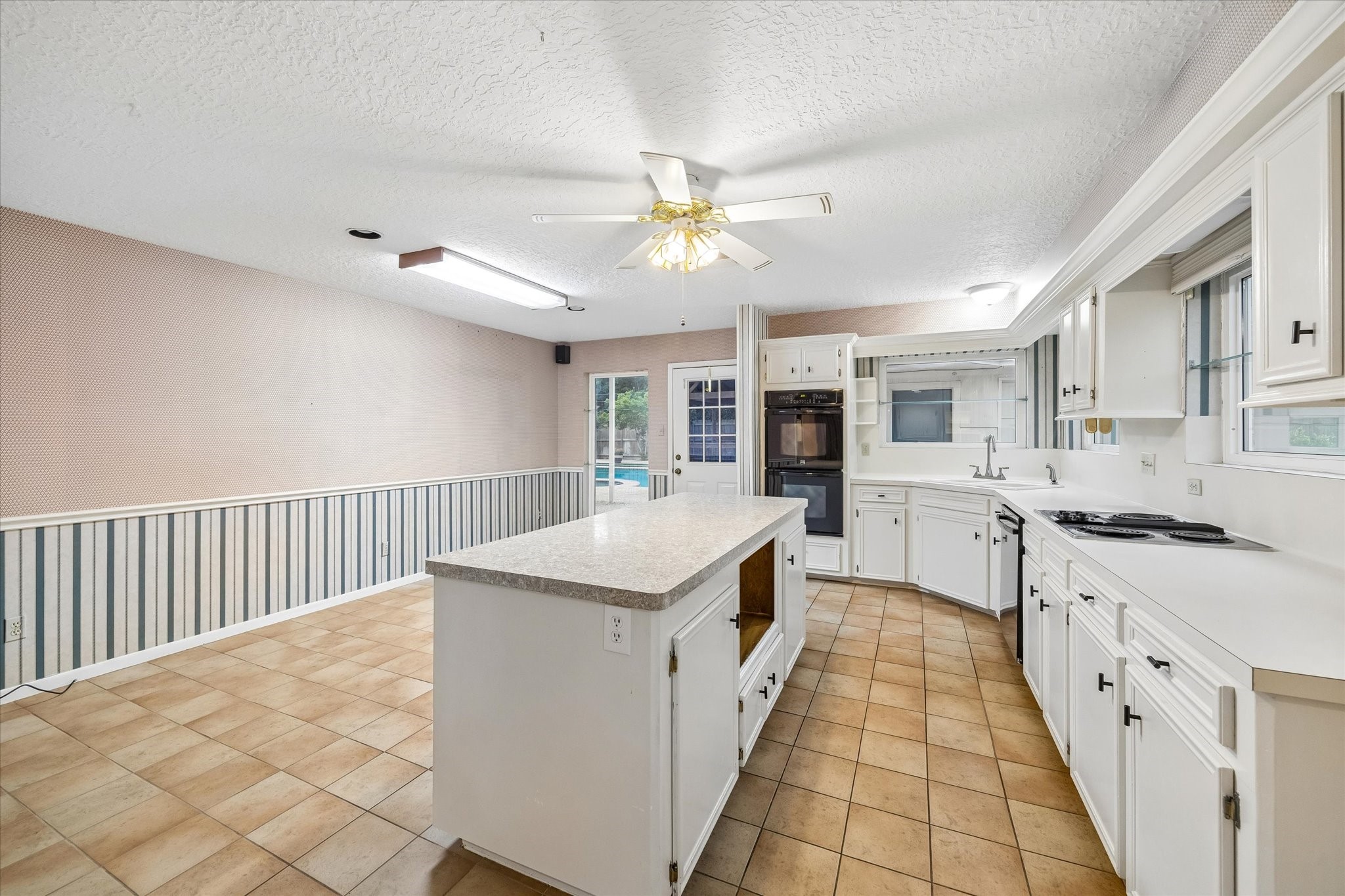 5515 Sylmar Road Houston, TX 77081 - Photo 8 of 28 Another view of the kitchen leading out toward the back door & patio. The space offered here will be temping for the chef of the family !
