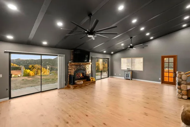 a view of a livingroom with furniture and a window