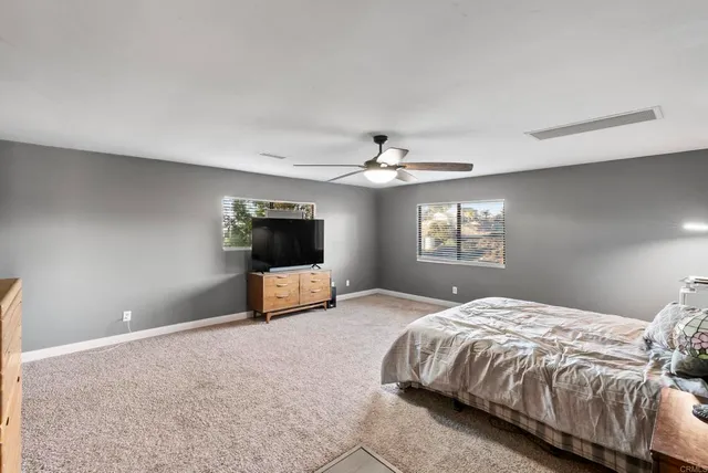 a bathroom with a double vanity sink mirror and shower