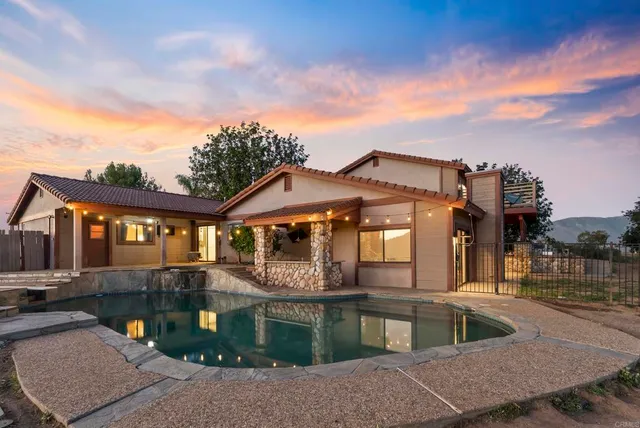 an aerial view of a house with a ocean view
