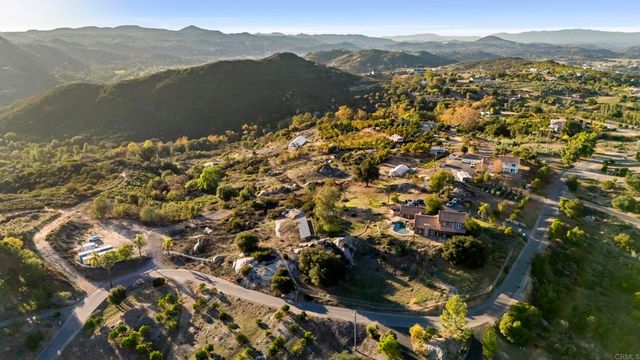 a kitchen with a table and chairs in it
