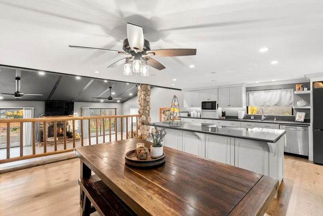 a view of a room with lots of gym equipment