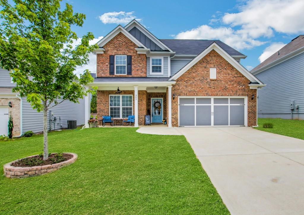 Welcome home to this stunning newer construction home in sought-after Oakhaven!