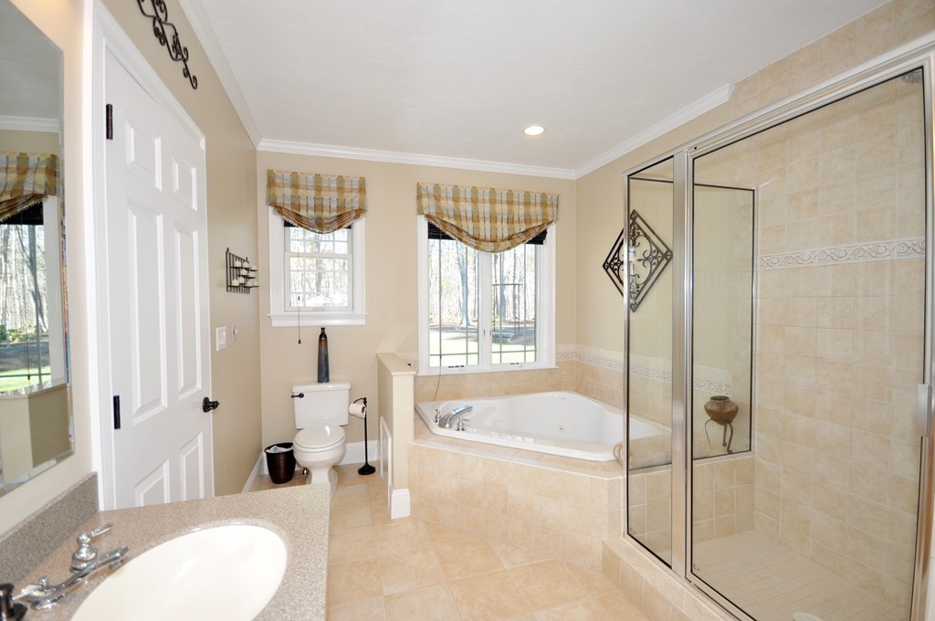 159 Fox Run Road Bolton, MA 01740 - Photo 16 of 30 a spacious bathroom with a tub shower and sink