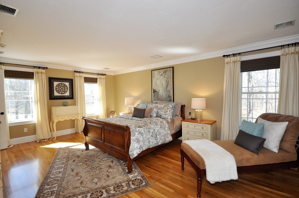 159 Fox Run Road Bolton, MA 01740 - Photo 17 of 30 a bedroom with a bed and wooden floor