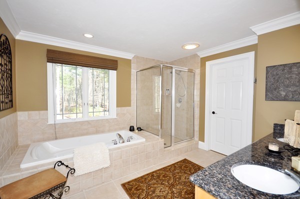 159 Fox Run Road Bolton, MA 01740 - Photo 19 of 30 a spacious bathroom with a granite countertop tub sink and mirror