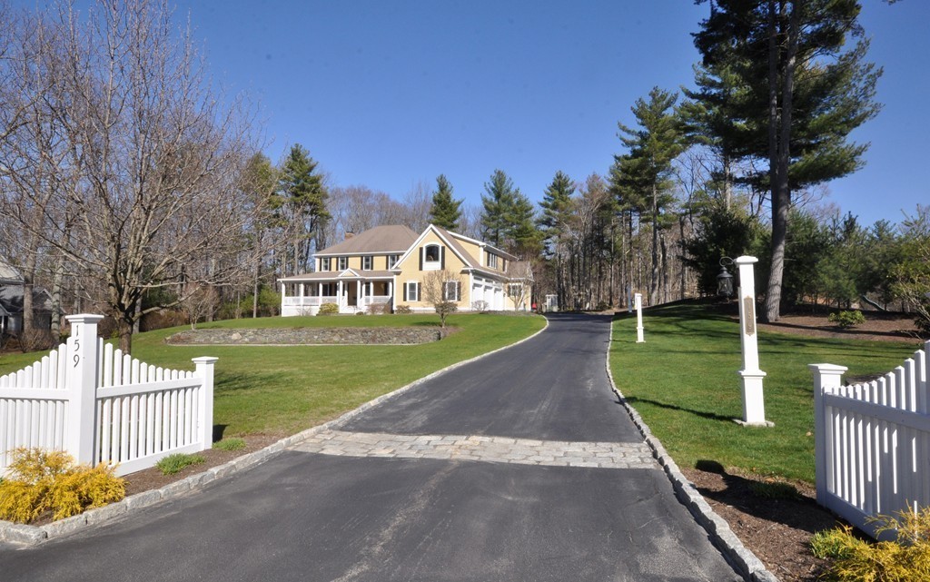 159 Fox Run Road Bolton, MA 01740 - Photo 2 of 30 a view of a house with a yard and large trees
