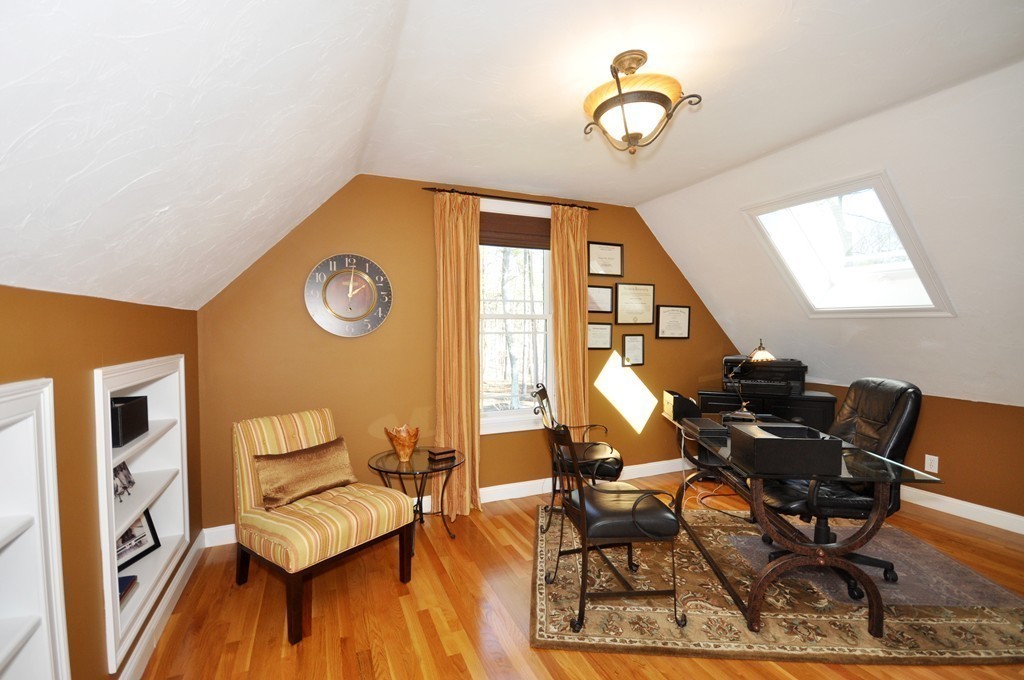 159 Fox Run Road Bolton, MA 01740 - Photo 22 of 30 a living room with chairs and a table