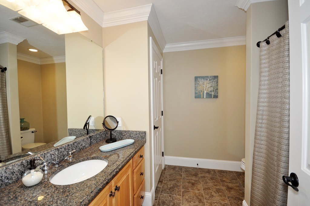 159 Fox Run Road Bolton, MA 01740 - Photo 26 of 30 a bathroom with a sink and a mirror