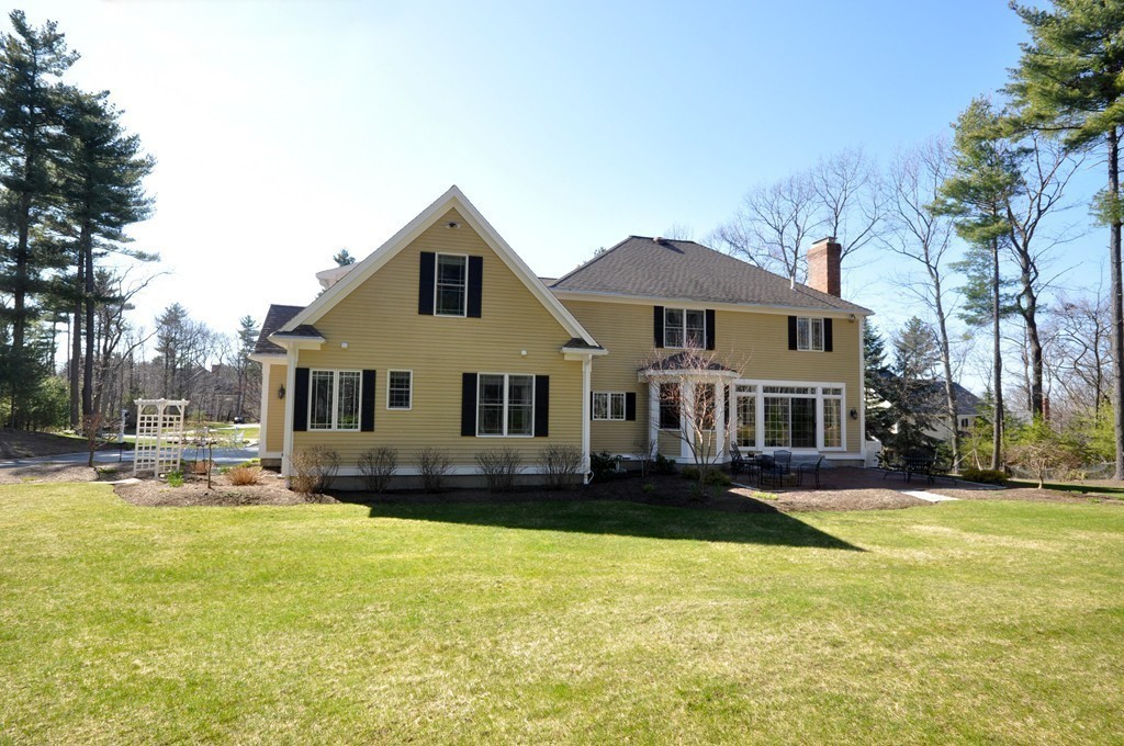 159 Fox Run Road Bolton, MA 01740 - Photo 29 of 30 a front view of a house with a yard table and chairs