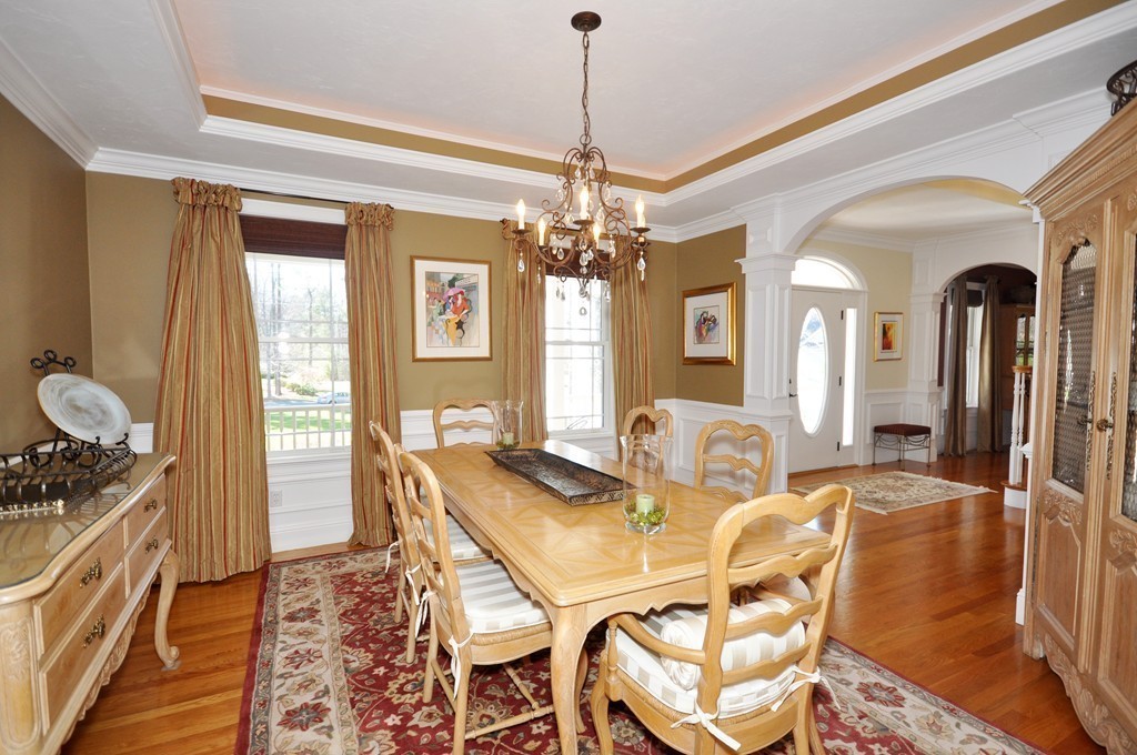 159 Fox Run Road Bolton, MA 01740 - Photo 6 of 30 a view of a dining room with furniture and chandelier