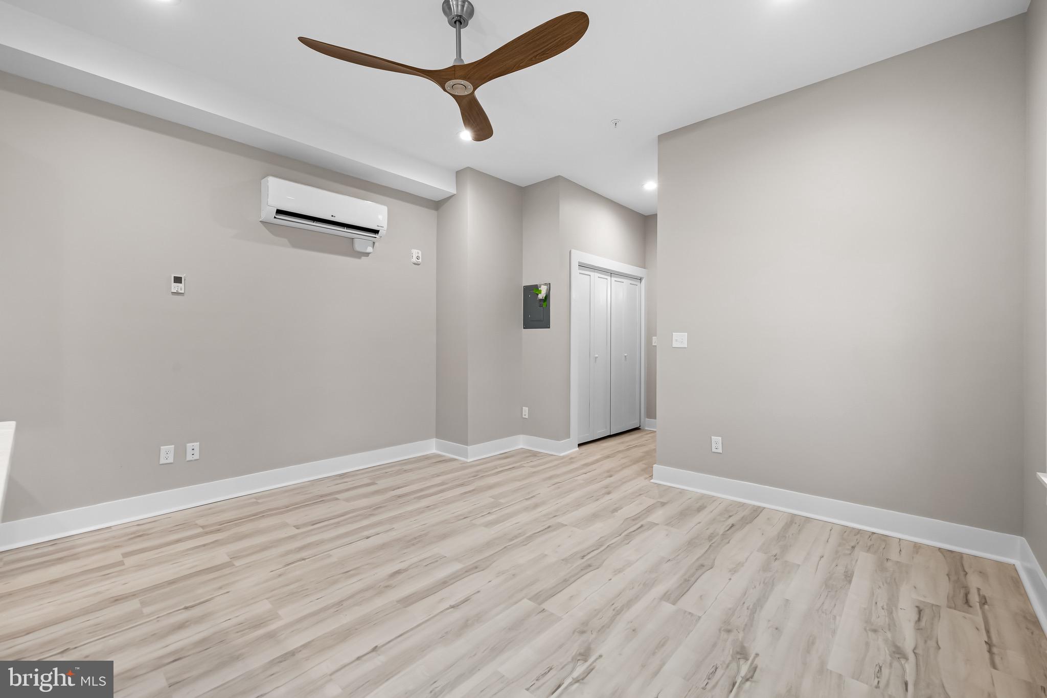 400 South Conkling Street, Unit 1 Baltimore, MD 21224 - Photo 7 of 18 a view of an empty room with wooden floor