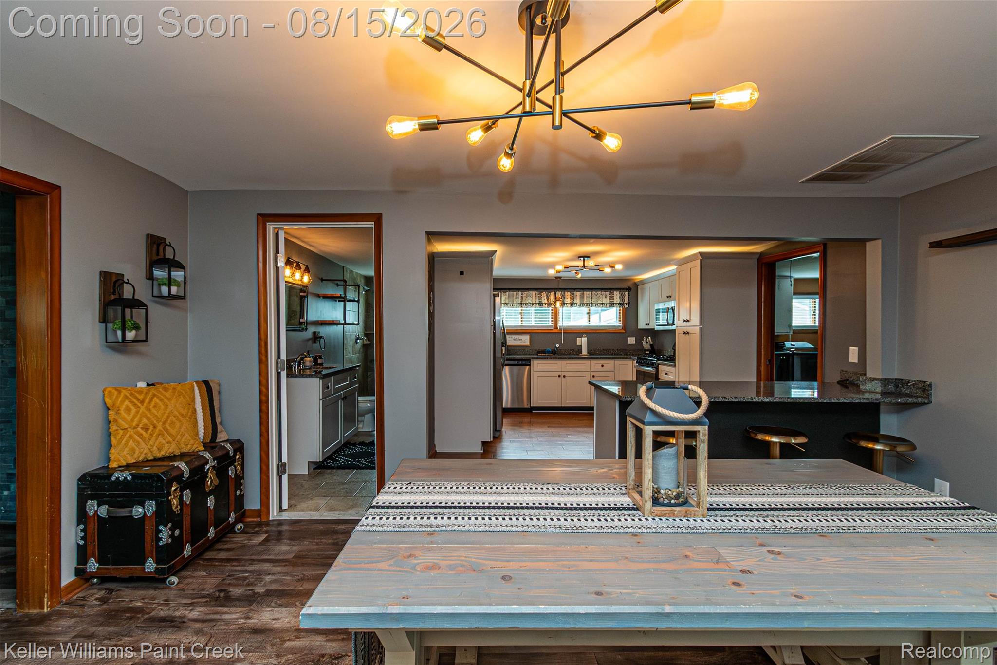 330 East Washington Street Romeo, MI 48065 - Photo 43 of 68 Wood-finish flooring with a modern linear chandelier