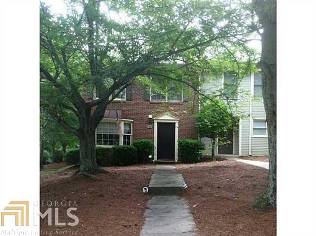 601 Oakmont Lane Norcross, GA 30093 - Photo 1 of 1 a front view of a house with garden