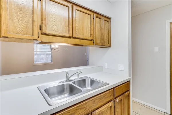 a white refrigerator freezer sitting inside of a kitchen