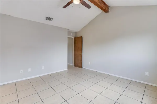 a bathroom with a bath tub with a shower
