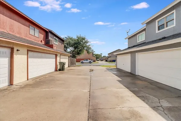 a view of a house with a yard and a garden