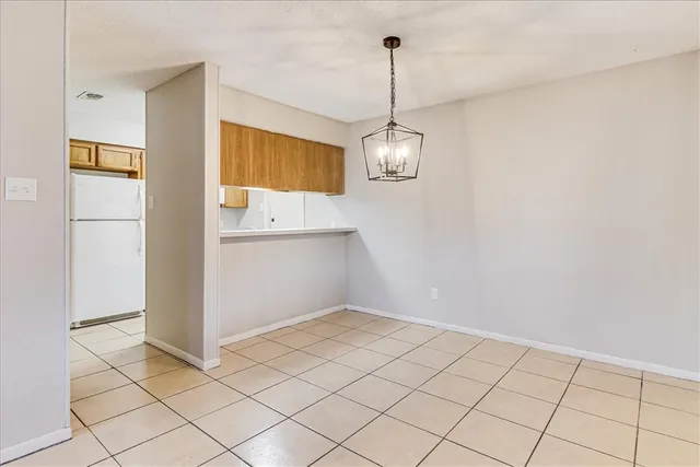 a view of an empty room and a window