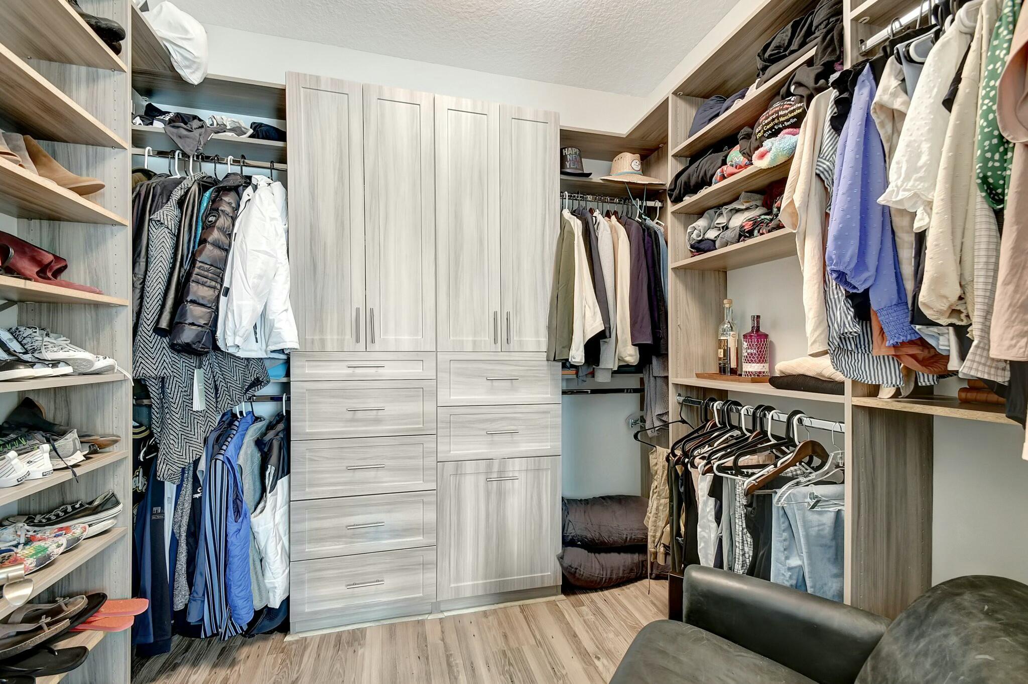 3110 Waterside Circle Boynton Beach, FL 33435 - Photo 13 of 40 a view of walk in closet with clothes and shoes