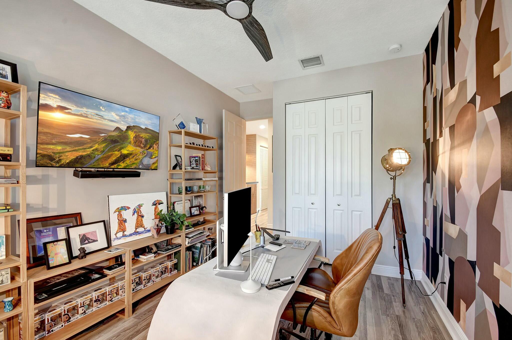 3110 Waterside Circle Boynton Beach, FL 33435 - Photo 14 of 40 a bedroom with furniture and a flat screen tv