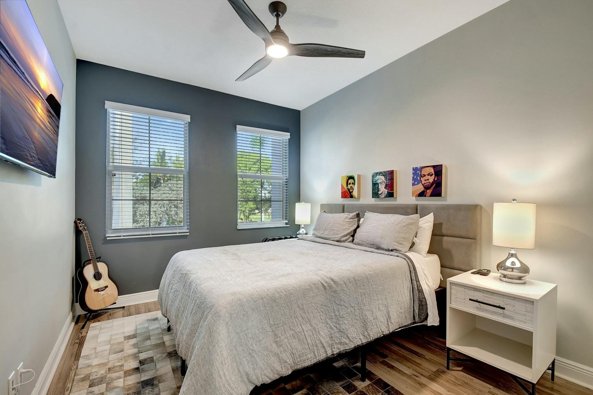 3110 Waterside Circle Boynton Beach, FL 33435 - Photo 16 of 40 a bedroom with a bed and a tv