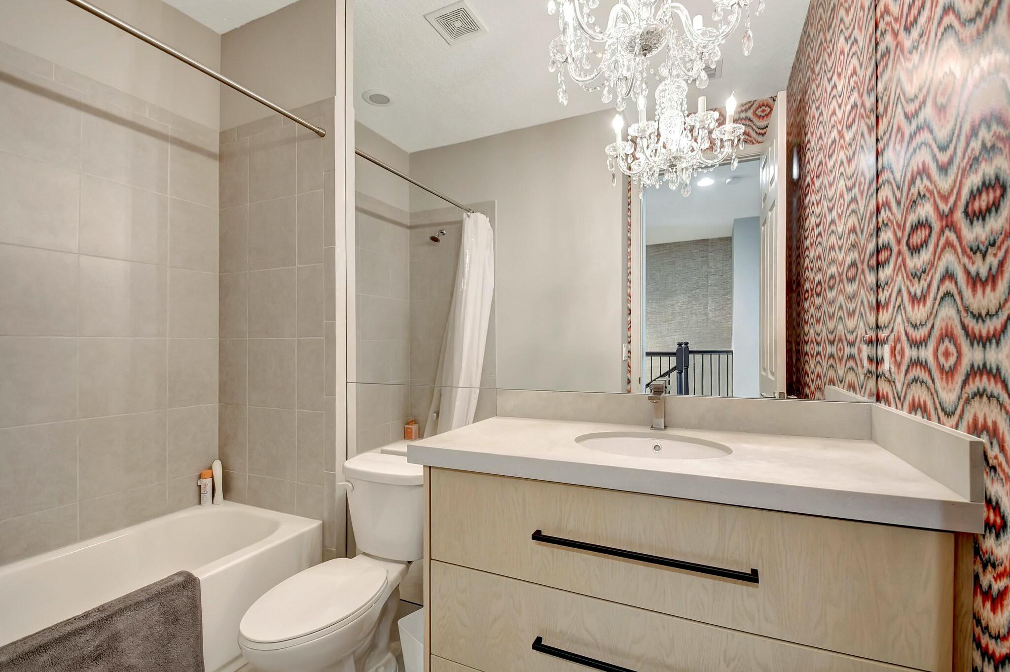 3110 Waterside Circle Boynton Beach, FL 33435 - Photo 17 of 40 a bathroom with a sink toilet a mirror and shower