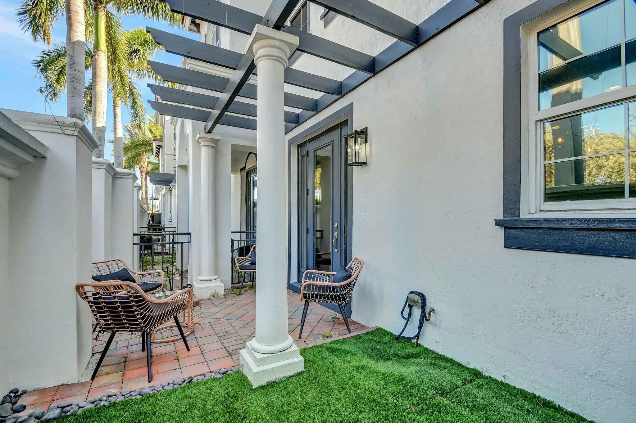 3110 Waterside Circle Boynton Beach, FL 33435 - Photo 20 of 40 a view of a porch with chairs and a table